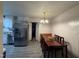 Bright dining area features stainless steel appliances and modern lighting at 6908 Park Pl, Raleigh, NC 27616