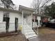Inviting front porch with painted stairs leading to the home's entryway at 6908 Park Pl, Raleigh, NC 27616