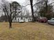 Inviting single-story home showcasing a well-maintained front yard and ample parking, perfect for Gathering and guests at 6908 Park Pl, Raleigh, NC 27616