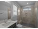 Stylish bathroom showcasing a shower with glass door and a modern vanity at 701 Jamescroft Way, Rolesville, NC 27571
