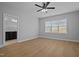 Bedroom with a ceiling fan, wood floors, and a view into the bathroom at 701 Jamescroft Way, Rolesville, NC 27571