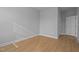Neutral bedroom boasts natural light, a door, and simple blinds on the window at 701 Jamescroft Way, Rolesville, NC 27571