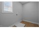Laundry room with hardwood floors and white walls ready for a washer and dryer at 701 Jamescroft Way, Rolesville, NC 27571