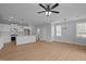 Open-concept living area with kitchen, dining, and living spaces featuring modern finishes at 701 Jamescroft Way, Rolesville, NC 27571