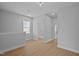 Bright loft area with wood floors, large windows, and white trim at 701 Jamescroft Way, Rolesville, NC 27571