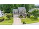 Lovely brick home with two-car garage, landscaped yard, and a charming covered front porch at 7336 Capulin Crest Dr, Apex, NC 27539