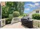 Expansive back deck offers ample outdoor entertaining space with lush backyard surroundings at 7336 Capulin Crest Dr, Apex, NC 27539