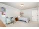 Cozy bedroom with light gray walls, desk, and a comfortable twin-size bed at 7336 Capulin Crest Dr, Apex, NC 27539