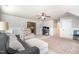 Bright bonus room featuring a comfortable seating arrangement, a ceiling fan and access to multiple rooms at 7336 Capulin Crest Dr, Apex, NC 27539