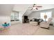 Spacious bonus room featuring large rug, window bench, and comfortable seating arrangement at 7336 Capulin Crest Dr, Apex, NC 27539