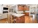 Stylish kitchen island, granite countertops, and stainless steel appliances at 7336 Capulin Crest Dr, Apex, NC 27539