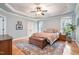 Comfortable main bedroom suite includes hardwood floors, tray ceilings, and natural light at 7336 Capulin Crest Dr, Apex, NC 27539