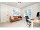 Bright office space featuring a leather sofa, a modern desk, and a large window at 7336 Capulin Crest Dr, Apex, NC 27539