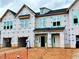 Townhome exterior under construction with visible framework and Mungo Homes wrap at 99 Ripple Way # 211, Clayton, NC 27520