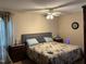 Cozy bedroom with a ceiling fan, comfortable bed, and ample natural light at 10 Winchester Ct, Durham, NC 27707