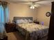 Comfortable bedroom with a large bed, ceiling fan, and matching nightstands with lamps at 10 Winchester Ct, Durham, NC 27707