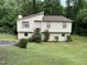 Traditional two-story home with siding, well maintained front lawn and mature landscaping at 10 Winchester Ct, Durham, NC 27707