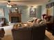 Inviting living room with a brick fireplace and plush seating, perfect for relaxation at 10 Winchester Ct, Durham, NC 27707