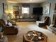 Spacious living room with plush seating arrangements, a large TV and fireplace at 10 Winchester Ct, Durham, NC 27707