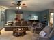 Comfortable living room with ceiling fan, and large sectional sofa seating at 10 Winchester Ct, Durham, NC 27707