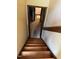 Wooden staircase leading down to another floor, providing access to other areas of the house at 10 Winchester Ct, Durham, NC 27707