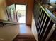 Staircase leading to an outdoor deck with a view of the backyard and a flower pot at 10 Winchester Ct, Durham, NC 27707