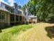 Backyard view showcases the screened porch, deck and wooded area at 102 Sanair Ct, Apex, NC 27502