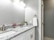 Double sink vanity with granite counters and updated fixtures in bathroom at 102 Sanair Ct, Apex, NC 27502