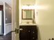 This bathroom features a dark wooden vanity with a white countertop at 102 Sanair Ct, Apex, NC 27502