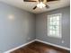 Bedroom features neutral paint, hardwood flooring, and a ceiling fan at 102 Sanair Ct, Apex, NC 27502