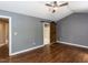 Spacious primary bedroom with hardwood floors and barn door to primary bath at 102 Sanair Ct, Apex, NC 27502