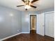 Bedroom boasts hardwood floors, neutral paint, a ceiling fan and closet at 102 Sanair Ct, Apex, NC 27502