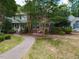 Traditional brick home with shutters, and a walkway at 102 Sanair Ct, Apex, NC 27502