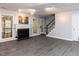 The living room features a fireplace, gray floors, and access to the backyard at 102 Sanair Ct, Apex, NC 27502