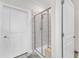 Stylish bathroom with a glass-enclosed shower and neutral tile at 1021 Shellbank Dr, Durham, NC 27703