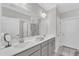 Bathroom with double sink, neutral paint, and an expansive mirror at 1021 Shellbank Dr, Durham, NC 27703