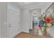 Welcoming foyer with hardwood floors and neutral tones, leading into a stylish living space at 1021 Shellbank Dr, Durham, NC 27703