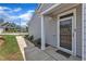 Charming covered front entrance showcasing a 'hello' welcome mat and a glimpse of the home's exterior at 1021 Shellbank Dr, Durham, NC 27703