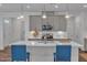 Modern kitchen with gray cabinets, stainless steel appliances, and a spacious island with barstool seating at 1021 Shellbank Dr, Durham, NC 27703