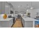 Well-appointed kitchen with gray cabinetry, stainless steel appliances, and ample counter space at 1021 Shellbank Dr, Durham, NC 27703