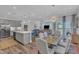 Open concept kitchen and dining area featuring modern appliances, a chandelier, and an adjoining living room at 1021 Shellbank Dr, Durham, NC 27703