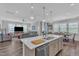 Open-concept living and dining area with hardwood floors and plenty of natural light at 1021 Shellbank Dr, Durham, NC 27703