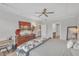 Main bedroom featuring an elegant tray ceiling, hardwood floors, and space for a full bedroom set at 1021 Shellbank Dr, Durham, NC 27703