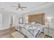 Spacious main bedroom with wood-look floors leads to the main bathroom and walk-in closet at 1021 Shellbank Dr, Durham, NC 27703