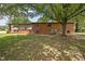 Expansive backyard featuring a brick home with a screened-in porch at 1051 Old Us 421, Lillington, NC 27546