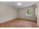 Bedroom featuring wood floors, natural light from a window, and neutral walls at 1051 Old Us 421, Lillington, NC 27546