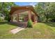 View of back of the house showcasing covered parking and brick construction at 1051 Old Us 421, Lillington, NC 27546