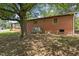 Rear exterior of the brick home, showing the AC unit and yard at 1051 Old Us 421, Lillington, NC 27546