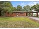 Charming brick ranch home featuring a covered carport, front yard, and traditional design elements at 1051 Old Us 421, Lillington, NC 27546