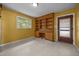 Bright home office with built-in shelving and desk space, providing a functional and organized workspace at 1051 Old Us 421, Lillington, NC 27546